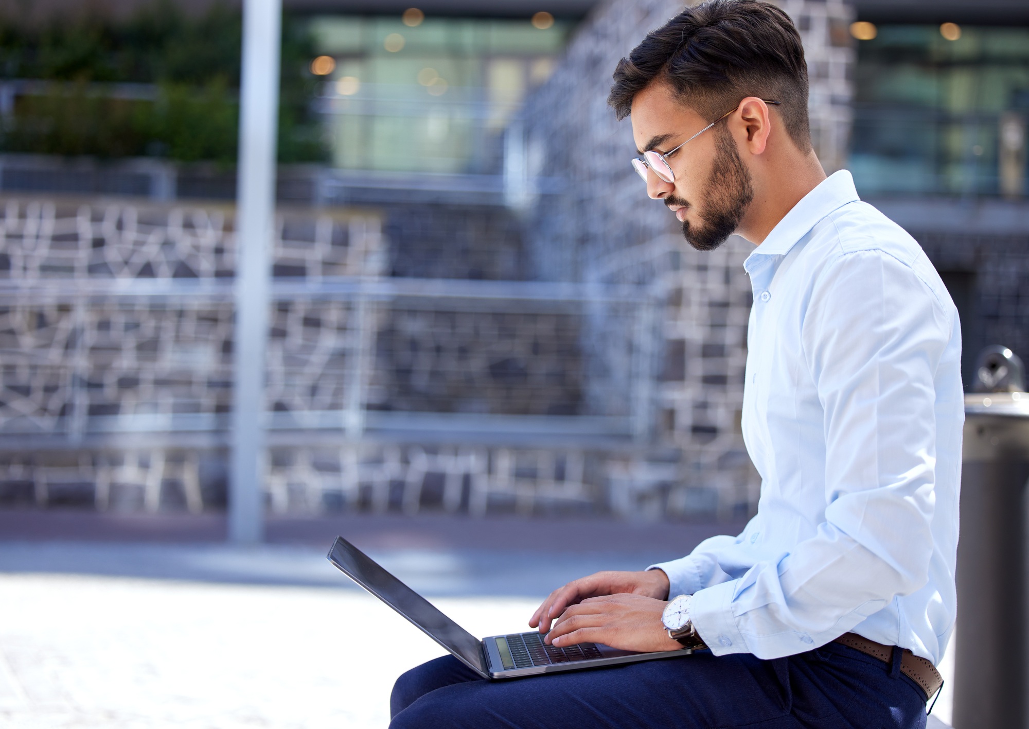 Entrepreneur, business and man with a laptop, outdoor and typing with connection, digital software