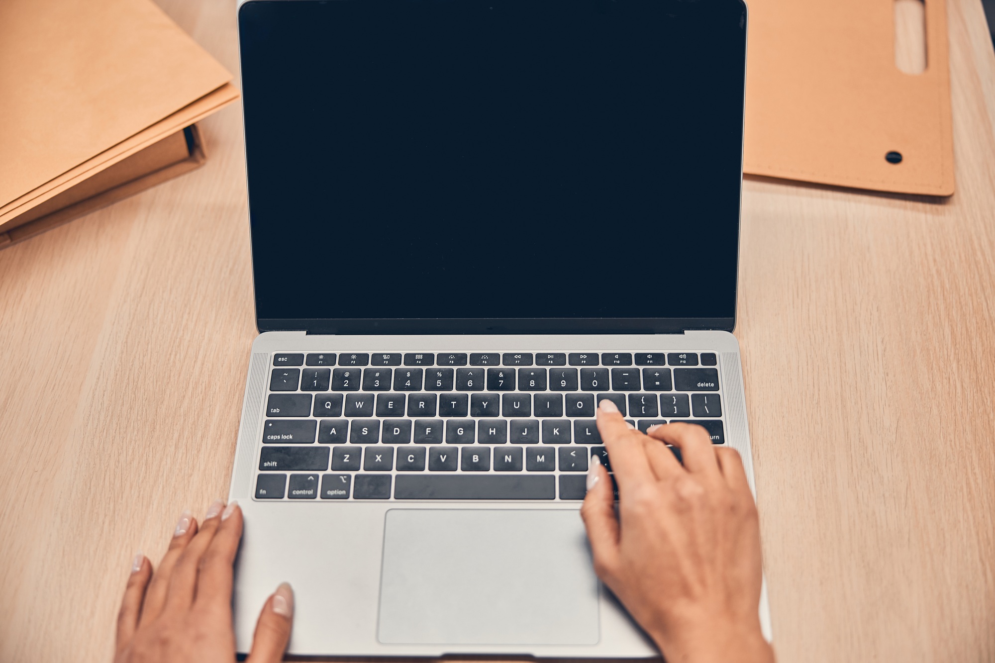 Female hands are working on modern laptop